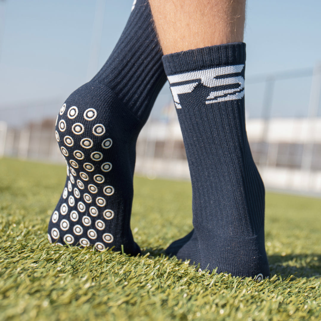 Warum tragen viele Fußballer Grip Socken unter den Stutzen?